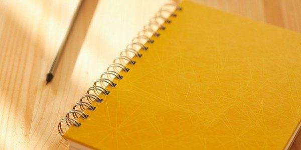 yellow note book About Informing Minds - Mental Health Practice Growth